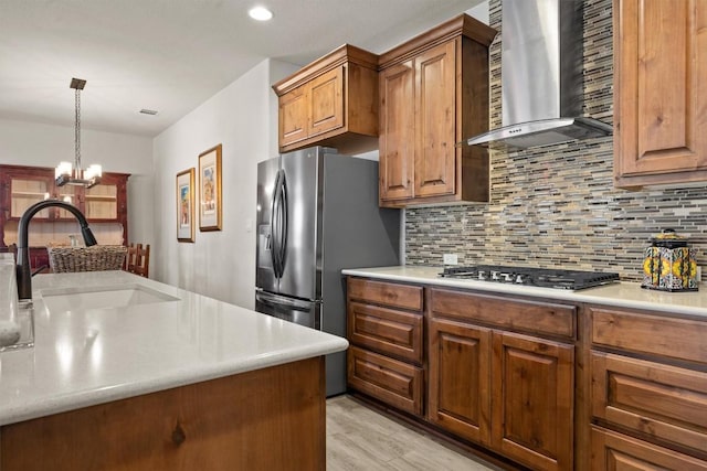 905 Indian Hawthorne Dr Unit G, Georgetown, TX 78628 - kitchen featuring wall chimney range hood, a sink, tasteful backsplash, stainless steel appliances, and recessed lighting