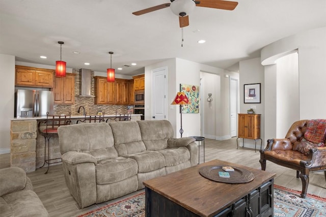 905 Indian Hawthorne Dr Unit G, Georgetown, TX 78628 - living room featuring light wood-style flooring, a ceiling fan, baseboards, and recessed lighting