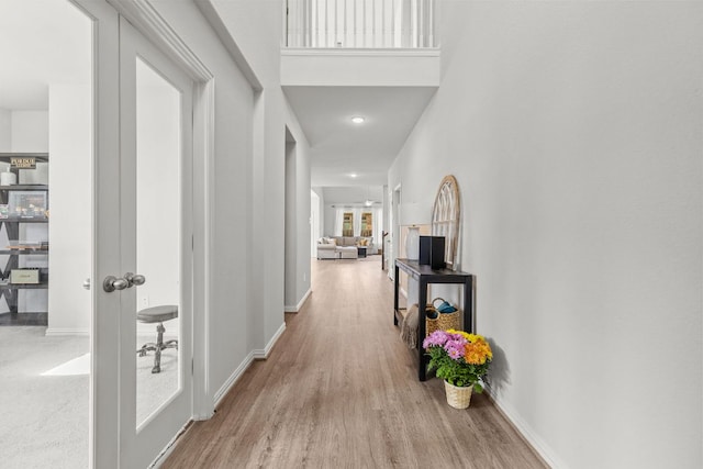 427 Bluejack Way, Hutto, TX 78634 - hall featuring wood finished floors, baseboards, french doors, and recessed lighting