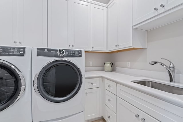 1107 Challenger, Lakeway, TX 78734 - laundry room featuring cabinet space and washer and dryer