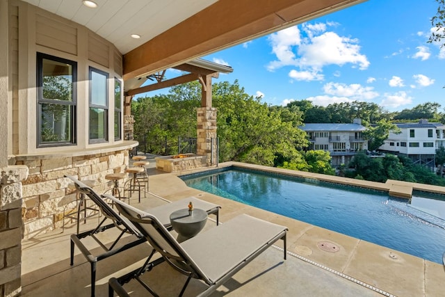 1107 Challenger, Lakeway, TX 78734 - swimming pool with a patio, an outdoor bar, and view of wooded area