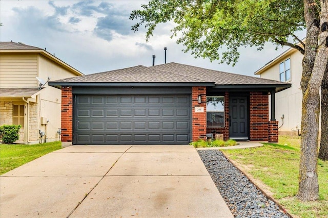 view of front of property with brick siding, an attached garage, and driveway