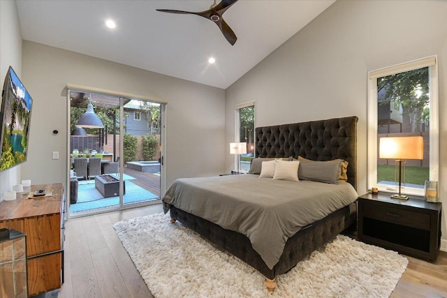 2010 Goodrich Ave Unit 5A, Austin, TX 78704 - bedroom featuring access to outside, wood finished floors, vaulted ceiling, multiple windows, and recessed lighting