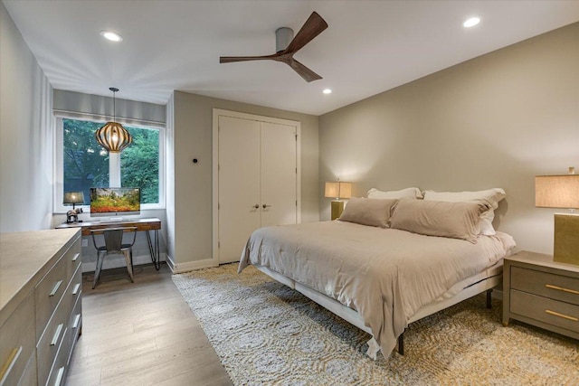 2010 Goodrich Ave Unit 5A, Austin, TX 78704 - bedroom with light wood-type flooring, recessed lighting, ceiling fan, and a closet