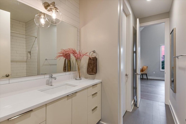 2010 Goodrich Ave Unit 5A, Austin, TX 78704 - full bath featuring vanity, baseboards, and tiled shower