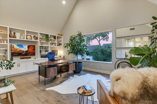 2010 Goodrich Ave Unit 5A, Austin, TX 78704 - office featuring high vaulted ceiling, light wood finished floors, and baseboards