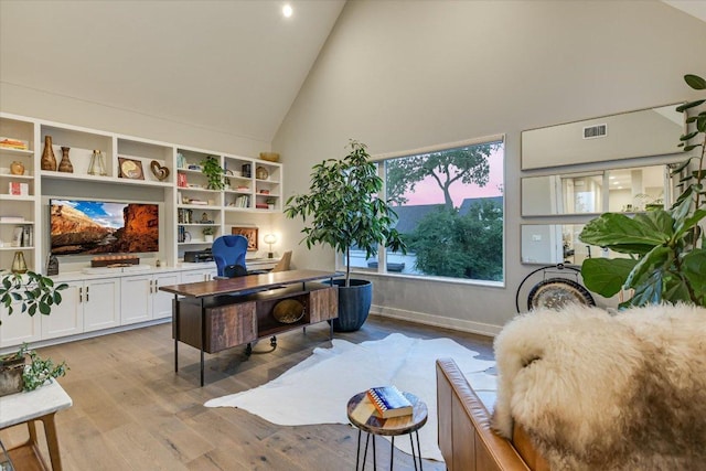 2010 Goodrich Ave Unit 5A, Austin, TX 78704 - home office with high vaulted ceiling and light wood-type flooring