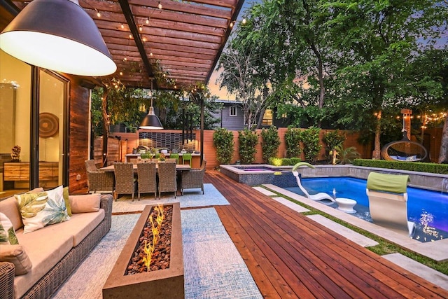 2010 Goodrich Ave Unit 5A, Austin, TX 78704 - view of swimming pool featuring area for grilling, an outdoor living space with a fire pit, a fenced backyard, outdoor dining space, and a wooden deck