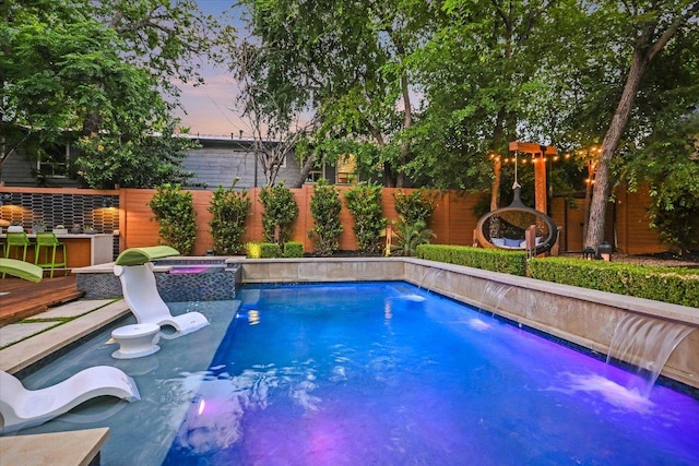 2010 Goodrich Ave Unit 5A, Austin, TX 78704 - view of swimming pool with an in-ground hot tub, a fenced backyard, and a wooden deck