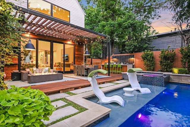 2010 Goodrich Ave Unit 5A, Austin, TX 78704 - pool at dusk featuring a deck, a pergola, an outdoor living space, and a pool with connected hot tub