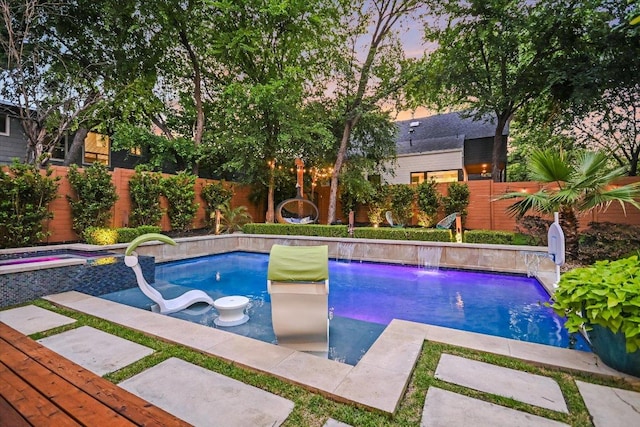 2010 Goodrich Ave Unit 5A, Austin, TX 78704 - pool at dusk featuring a fenced backyard