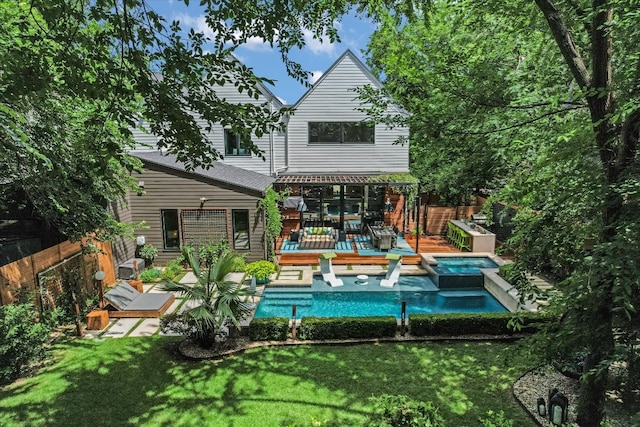 2010 Goodrich Ave Unit 5A, Austin, TX 78704 - rear view of house with a wooden deck and a pool with connected hot tub