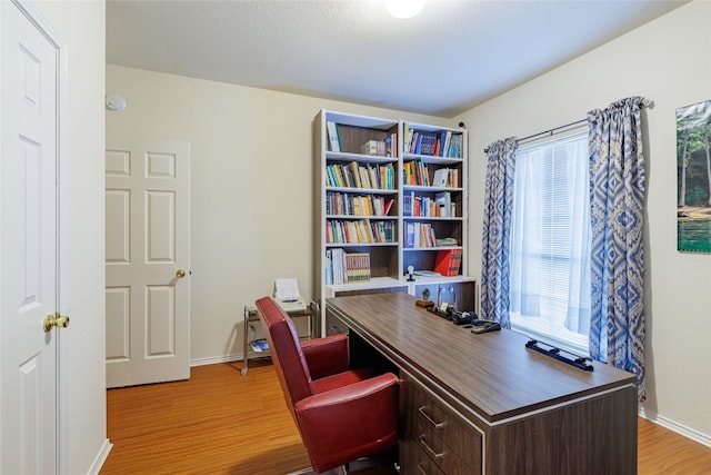 5219 Moon Shadow Dr, Austin, TX 78735 - office area featuring wood finished floors and baseboards