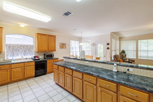 5219 Moon Shadow Dr, Austin, TX 78735 - kitchen with black dishwasher, stainless steel microwave, decorative backsplash, a sink, and light tile patterned flooring
