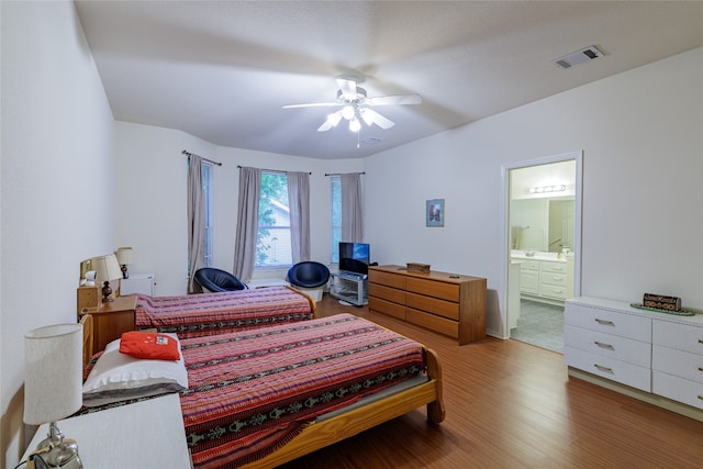 5219 Moon Shadow Dr, Austin, TX 78735 - bedroom with wood finished floors, ensuite bath, and a ceiling fan
