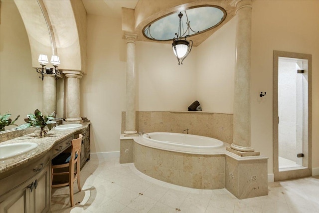 12861 Hughes Park Rd, Austin, TX 78732 - bathroom with ornate columns, a bath, tile patterned flooring, and double vanity