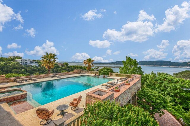 12861 Hughes Park Rd, Austin, TX 78732 - view of swimming pool with a water view, a patio, and a pool with connected hot tub