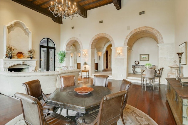 12861 Hughes Park Rd, Austin, TX 78732 - dining area featuring a towering ceiling, a chandelier, wood finished floors, wooden ceiling, and beamed ceiling