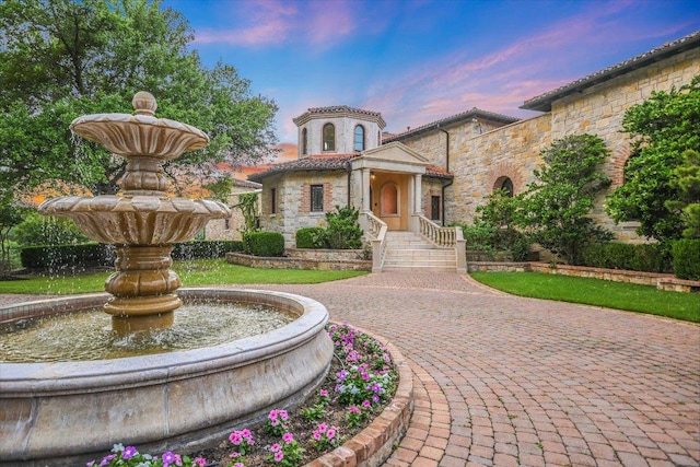 12861 Hughes Park Rd, Austin, TX 78732 - mediterranean / spanish-style home with stone siding