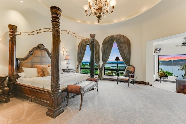 12861 Hughes Park Rd, Austin, TX 78732 - bedroom featuring carpet floors, a chandelier, access to exterior, and baseboards