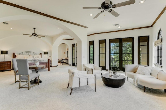 12861 Hughes Park Rd, Austin, TX 78732 - carpeted living area featuring arched walkways, ornamental molding, ceiling fan, recessed lighting, and baseboards
