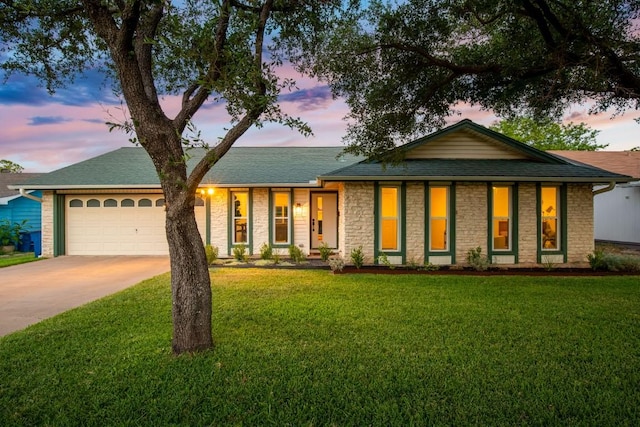 8907 Hunters Trce, Austin, TX 78758 - single story home featuring driveway, a garage, stone siding, a front lawn, and a shingled roof