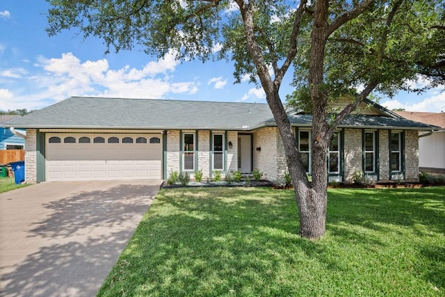 8907 Hunters Trce, Austin, TX 78758 - ranch-style home featuring a garage, concrete driveway, a front lawn, a shingled roof, and stone siding