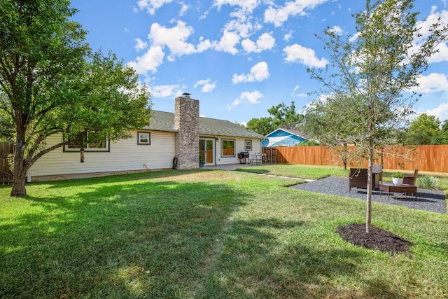 8907 Hunters Trce, Austin, TX 78758 - back of property with a patio area and a chimney