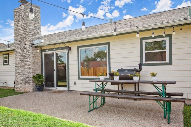 8907 Hunters Trce, Austin, TX 78758 - rear view of property with a patio area and a chimney
