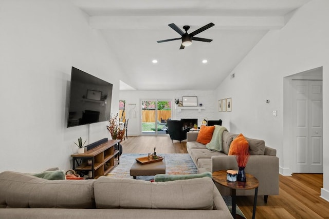 8907 Hunters Trce, Austin, TX 78758 - living room featuring wood finished floors, beam ceiling, high vaulted ceiling, ceiling fan, and a large fireplace