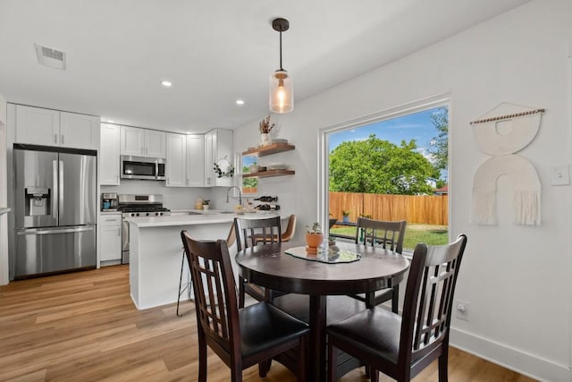 8907 Hunters Trce, Austin, TX 78758 - dining space featuring light wood-type flooring, recessed lighting, and baseboards