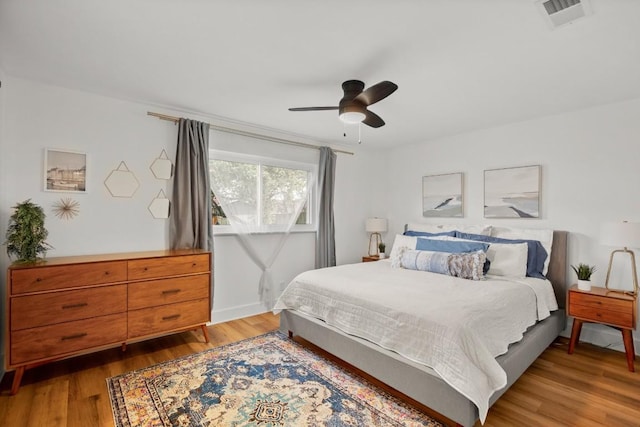 8907 Hunters Trce, Austin, TX 78758 - bedroom with wood finished floors and ceiling fan