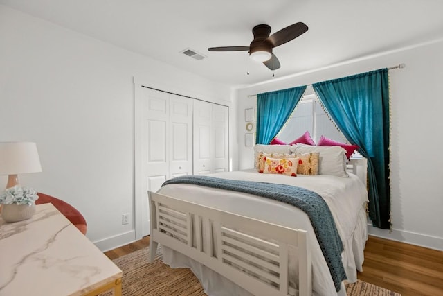 8907 Hunters Trce, Austin, TX 78758 - bedroom with a closet, wood finished floors, baseboards, and a ceiling fan