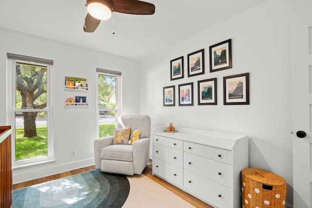 8907 Hunters Trce, Austin, TX 78758 - living area with light wood-style floors and a ceiling fan