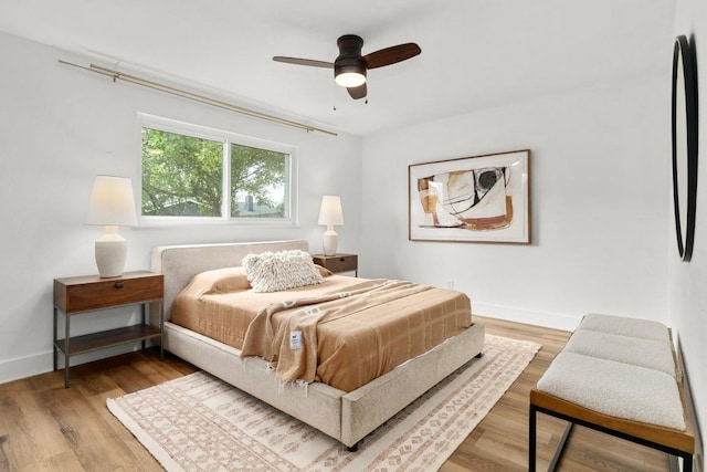 8907 Hunters Trce, Austin, TX 78758 - bedroom featuring wood finished floors and a ceiling fan