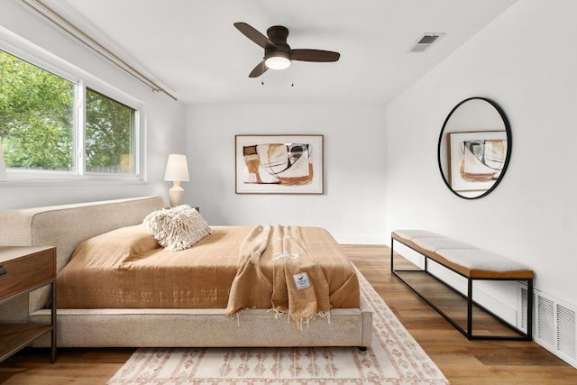 8907 Hunters Trce, Austin, TX 78758 - bedroom with wood finished floors and ceiling fan