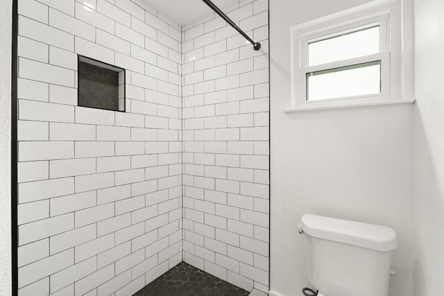 8907 Hunters Trce, Austin, TX 78758 - bathroom featuring toilet and tiled shower