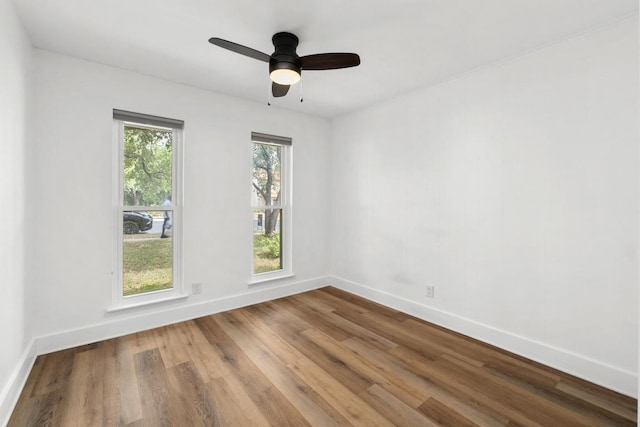 8907 Hunters Trce, Austin, TX 78758 - unfurnished room with wood finished floors and ceiling fan