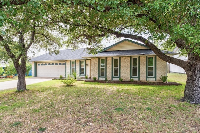 8907 Hunters Trce, Austin, TX 78758 - ranch-style house featuring a garage, a front yard, concrete driveway, and stone siding