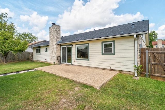 8907 Hunters Trce, Austin, TX 78758 - back of property with a patio area, a chimney, and a shingled roof