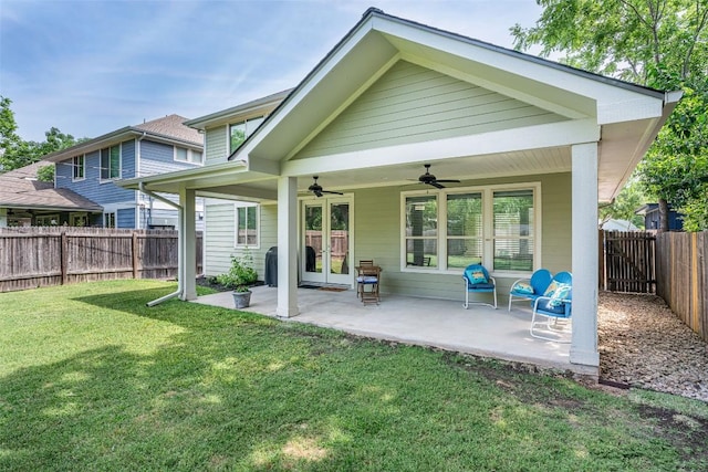705 E 49th St Unit A, Austin, TX 78751 - back of property featuring ceiling fan, a fenced backyard, a patio area, and french doors