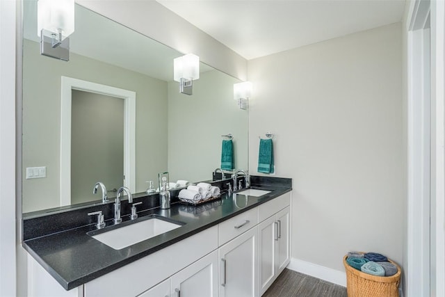 705 E 49th St Unit A, Austin, TX 78751 - full bathroom featuring double vanity and wood finished floors