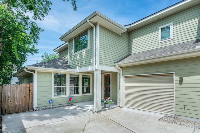 705 E 49th St Unit A, Austin, TX 78751 - view of front of property with concrete driveway, a shingled roof, and an attached garage