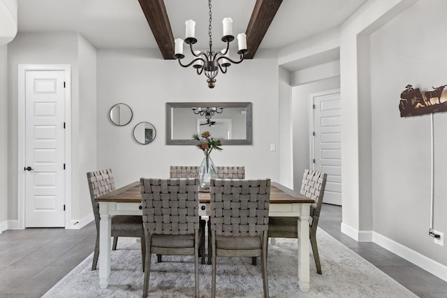 138 Prism Cv, Dripping Springs, TX 78620 - dining area featuring a chandelier, beamed ceiling, and baseboards