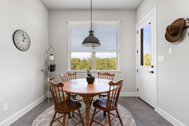 138 Prism Cv, Dripping Springs, TX 78620 - dining area with baseboards and dark tile patterned floors