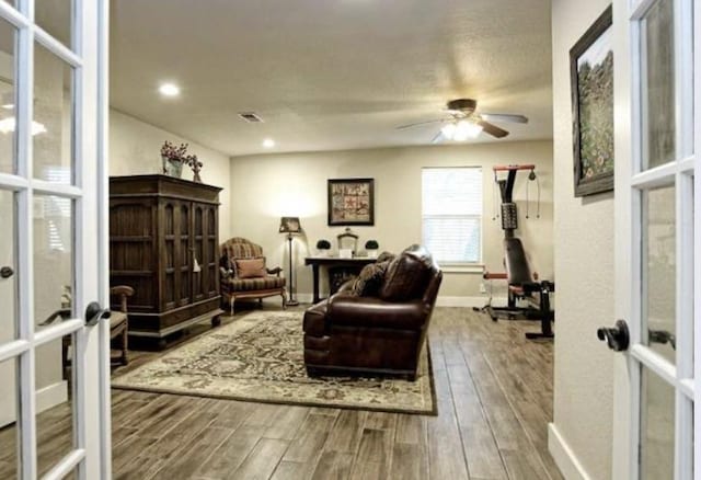 109 Ridgeview, Horseshoe Bay, TX 78657 - living area with wood finished floors, ceiling fan, baseboards, french doors, and recessed lighting