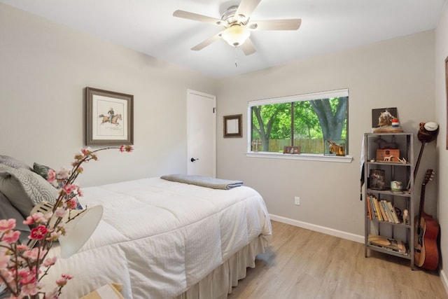 10730 N Platt River Dr, Austin, TX 78748 - bedroom with light wood finished floors, baseboards, and ceiling fan