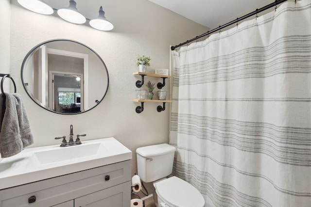 10730 N Platt River Dr, Austin, TX 78748 - bathroom with toilet, vanity, and a textured wall