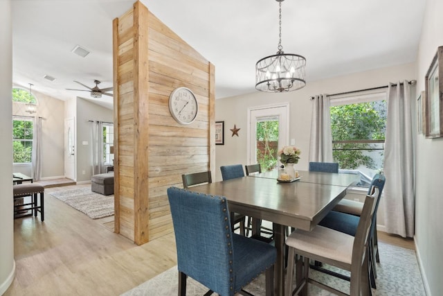 10730 N Platt River Dr, Austin, TX 78748 - dining space featuring light wood finished floors, plenty of natural light, and a chandelier