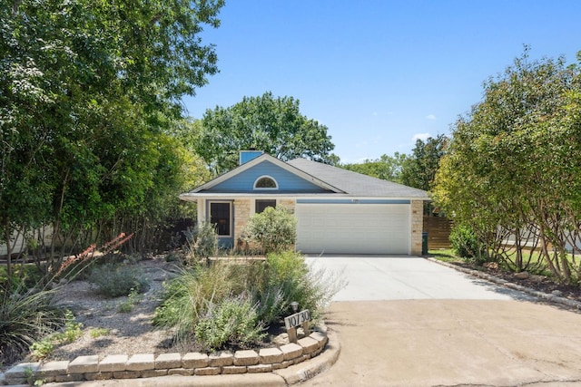 10730 N Platt River Dr, Austin, TX 78748 - view of front of property with stone siding, a garage, and driveway